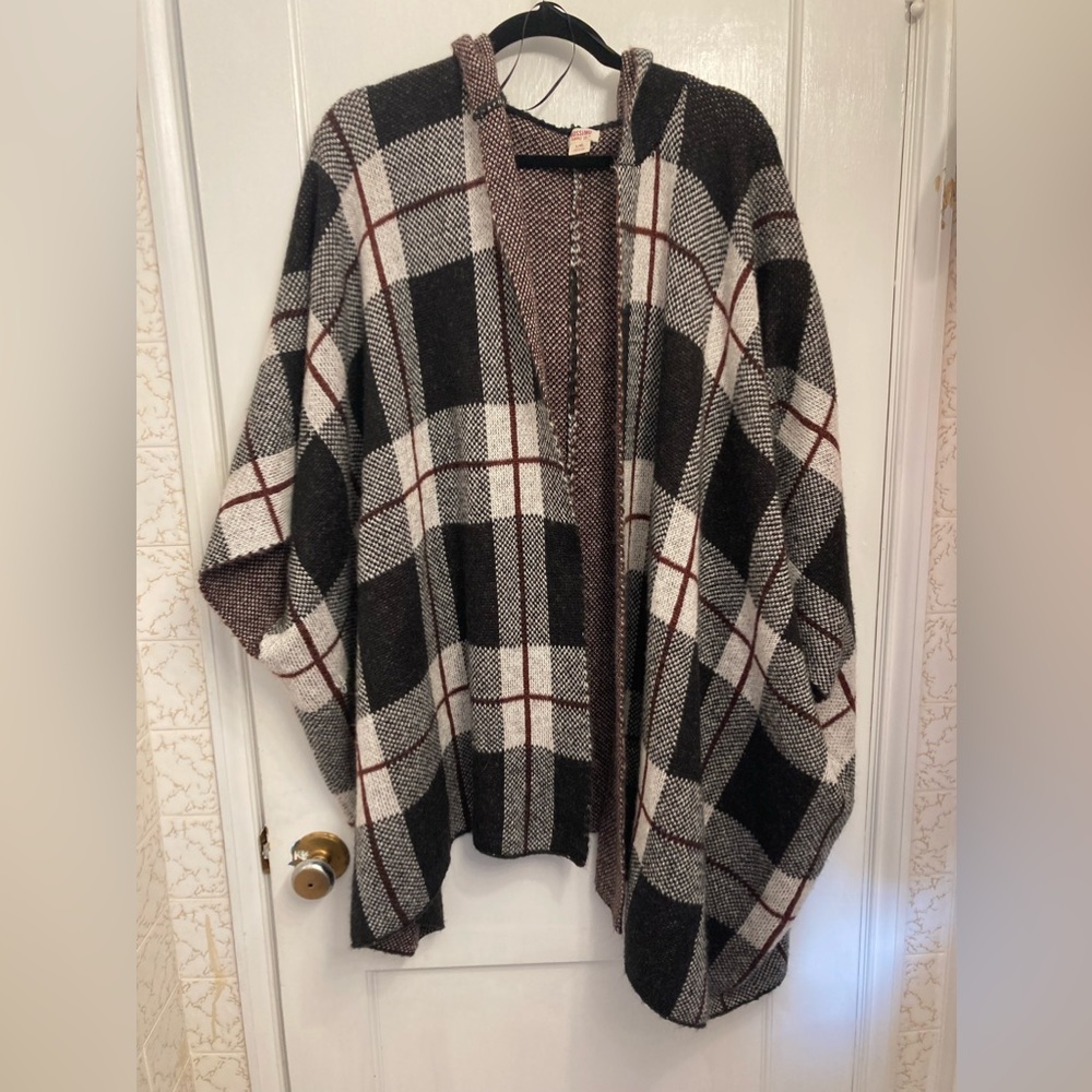 Heavy woolen winter cape with sleeve access and hood.